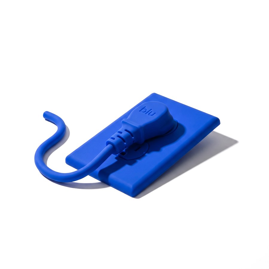 Blue silicone plug in a wall outlet